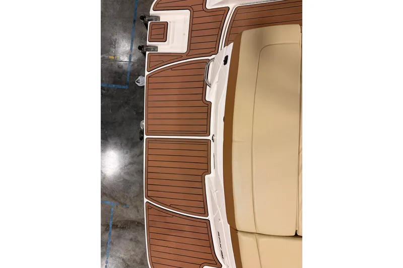 Slide: The Image of 2018 Sea Ray SPX 210 boat deck with brown and beige seating. - 19
