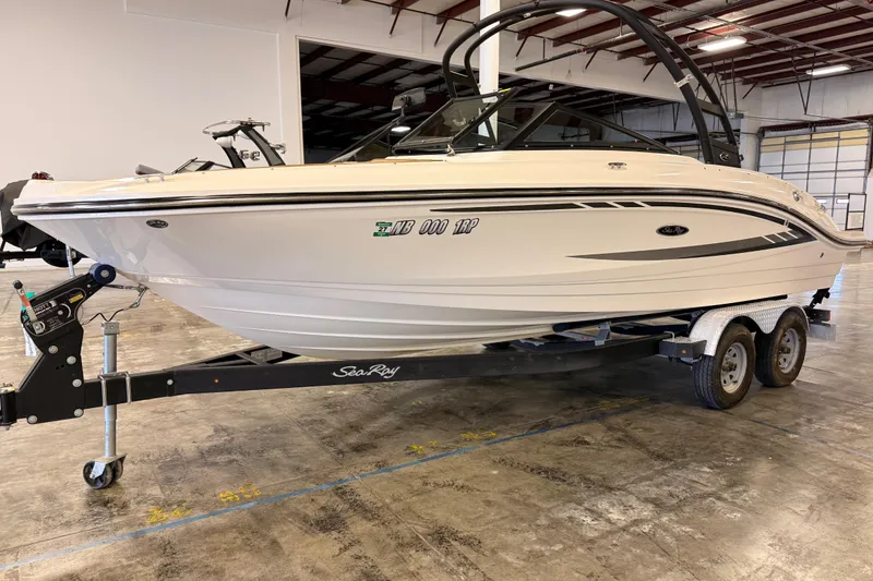 Slide: The Image of 2018 Sea Ray SPX 210 boat on trailer in indoor storage facility. - 4