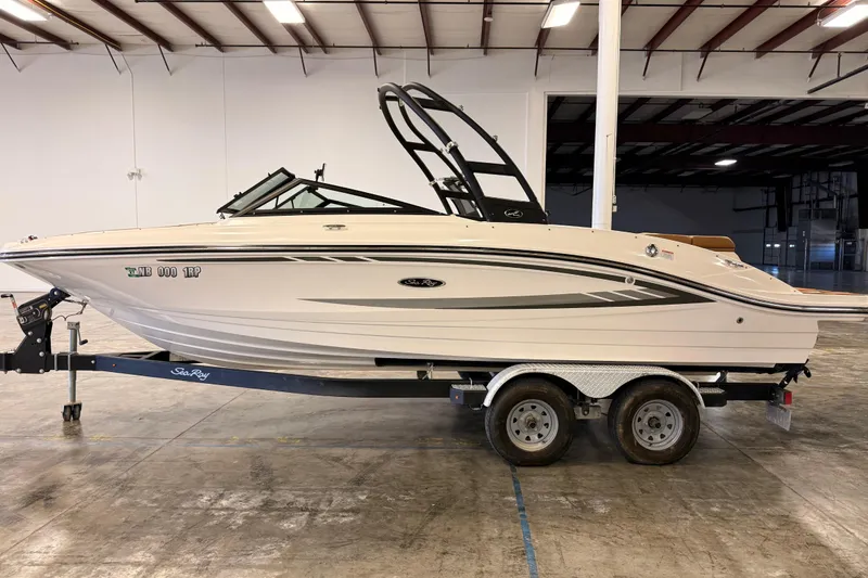 Slide: The Image of 2018 Sea Ray SPX 210 boat on trailer in indoor storage facility. - 5