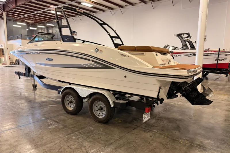 Slide: The Image of 2018 Sea Ray SPX 210 boat on trailer in indoor showroom. - 6