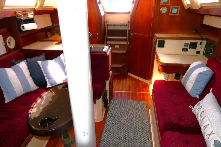 Slide: The Image of Interior of a 1989 Catalina 34 sailboat with cozy seating and nautical decor. - 10