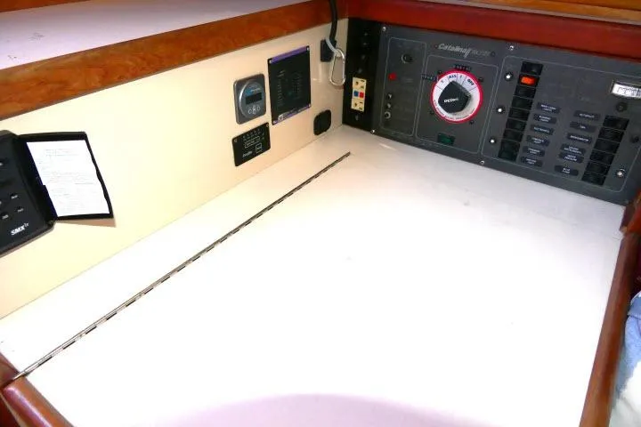 Slide: The Image of Control panel of a 1989 Catalina 34 sailboat with navigation instruments. - 13