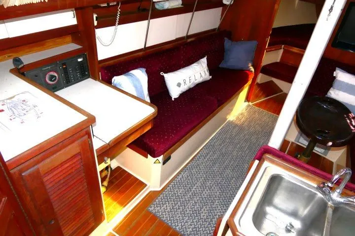 Slide: The Image of Interior of a 1989 Catalina 34 sailboat with cozy seating and nautical decor. - 3