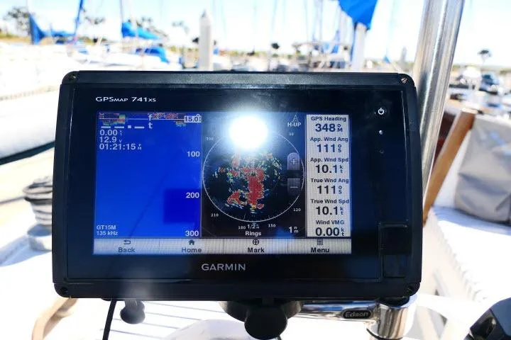 Slide: The Image of Garmin GPS display on 1989 Catalina 34 sailboat, showing navigation and wind data. - 42