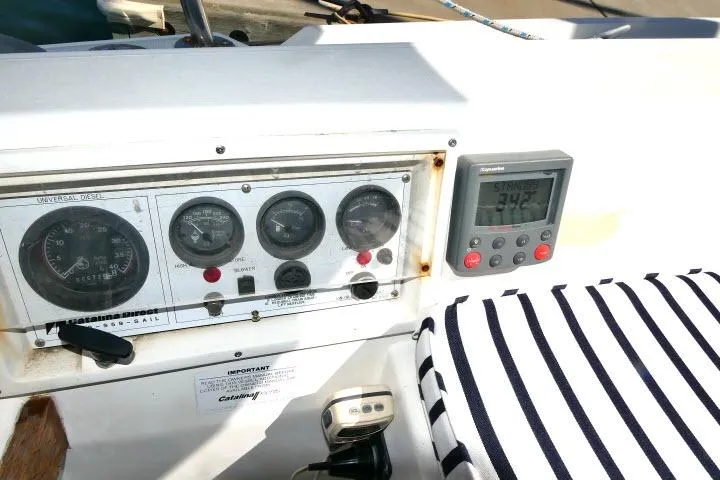 Slide: The Image of Control panel of a 1989 Catalina 34 sailboat with gauges and digital display. - 45