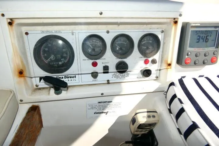 Slide: The Image of Control panel of a 1989 Catalina 34 sailboat with gauges and navigation equipment. - 46