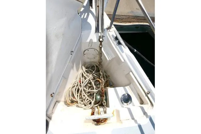 Slide: The Image of Anchor and rope on 1989 Catalina 34 sailboat deck. - 55