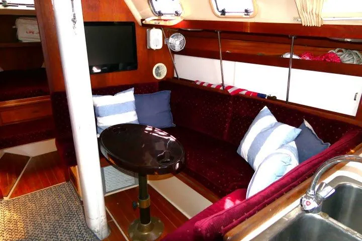 Slide: The Image of Interior of a 1989 Catalina 34 sailboat with cozy seating and nautical decor. - 7
