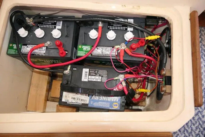 Slide: The Image of Battery compartment of a 1989 Catalina 34 sailboat with multiple marine batteries. - 70