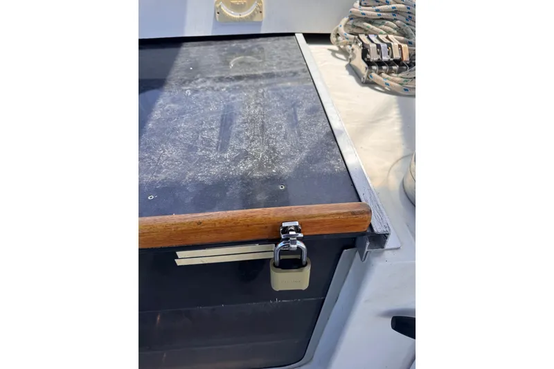 Slide: The Image of 1992 Hunter Passage 42 yacht deck with wooden handle and secured hatch. - 103