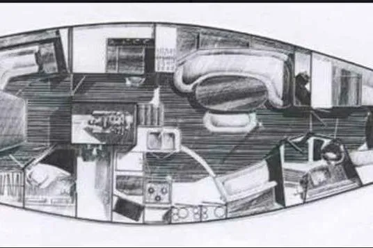 Slide: The Image of Interior layout of a 1992 Hunter Passage 42 sailboat, featuring living and dining areas. - 106