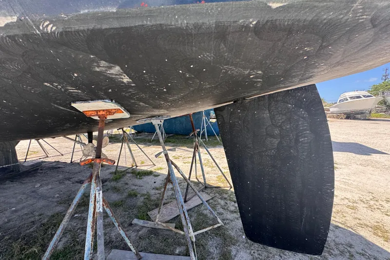 Slide: The Image of Bottom view of a 1992 Hunter Passage 42 sailboat on stands, showing keel and rudder. - 20