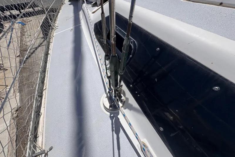 Slide: The Image of Deck view of a 1992 Hunter Passage 42 sailboat, showing rigging and safety netting. - 33