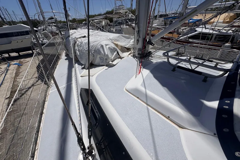 Slide: The Image of Deck view of a 1992 Hunter Passage 42 sailboat in a marina. - 34