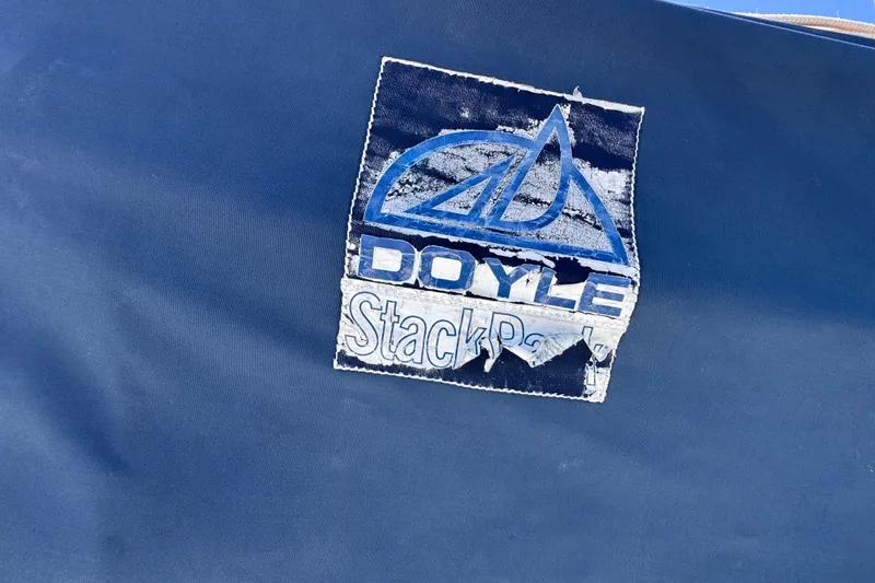 Slide: The Image of Blue Doyle StackPack logo on a 1992 Hunter Passage 42 sail cover. - 40