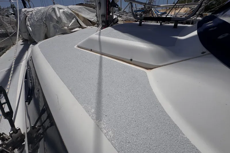 Slide: The Image of Deck of 1992 Hunter Passage 42 sailboat with textured surface and rigging details. - 42