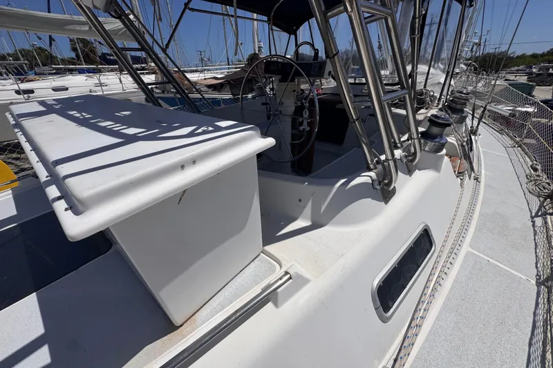 Slide: The Image of Hunter Passage 42 sailboat cockpit, 1992 model, featuring steering wheel and deck details. - 43