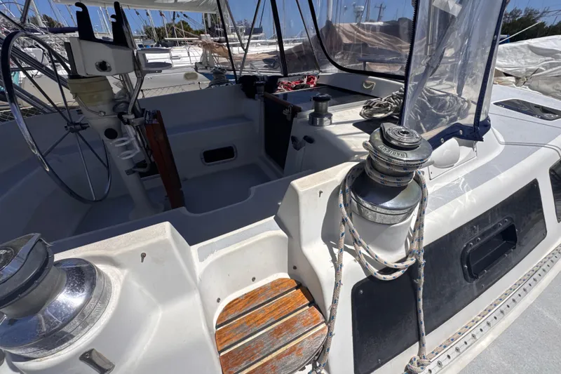 Slide: The Image of Cockpit of 1992 Hunter Passage 42 sailboat with steering wheel and winches. - 45