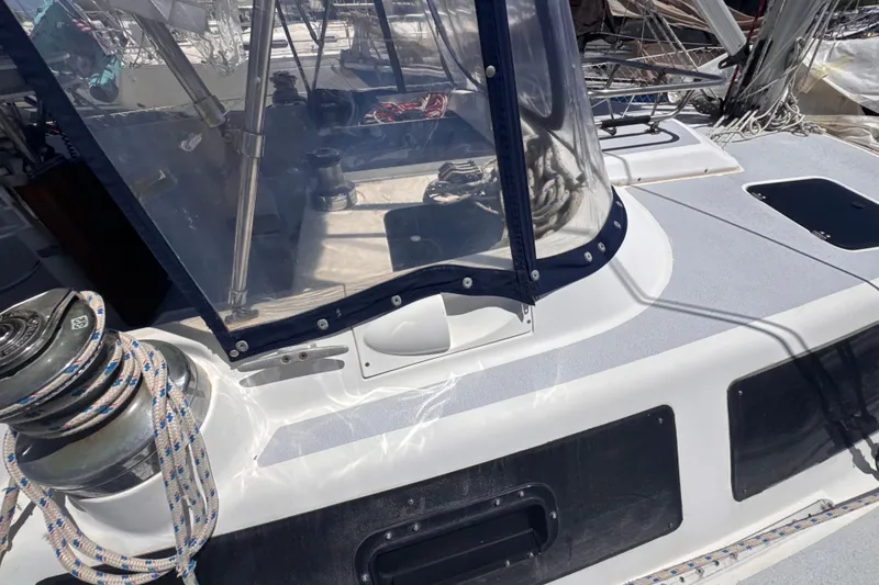 Slide: The Image of 1992 Hunter Passage 42 sailboat deck with winch and clear canopy. - 46