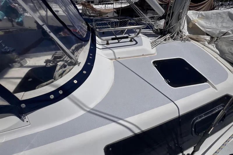 Slide: The Image of 1992 Hunter Passage 42 sailboat deck with hatch and rigging details. - 47