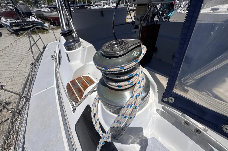 Slide: The Image of Close-up of a winch with rope on a 1992 Hunter Passage 42 sailboat deck. - 52