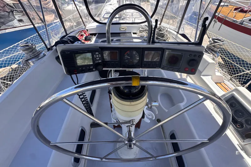 Slide: The Image of Cockpit of 1992 Hunter Passage 42 sailboat with steering wheel and navigation instruments. - 55