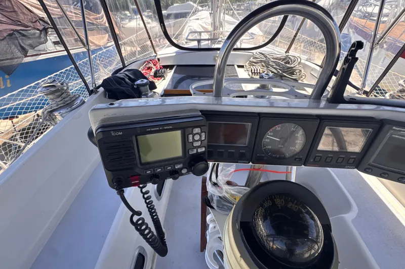 Slide: The Image of Cockpit of 1992 Hunter Passage 42 sailboat with navigation instruments and steering wheel. - 56
