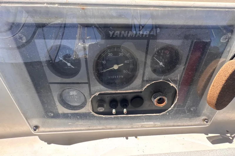 Slide: The Image of Control panel of a 1992 Hunter Passage 42 sailboat with Yanmar engine gauges. - 58