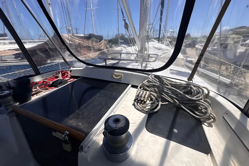 Slide: The Image of Cockpit view of 1992 Hunter Passage 42 sailboat with ropes and winch. - 59