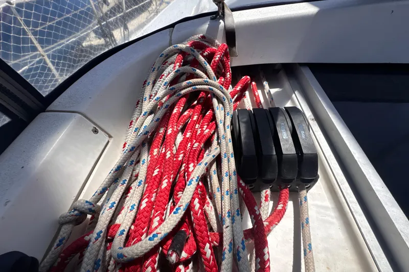 Slide: The Image of Coiled ropes on a 1992 Hunter Passage 42 sailboat deck, with rope clutches. - 61