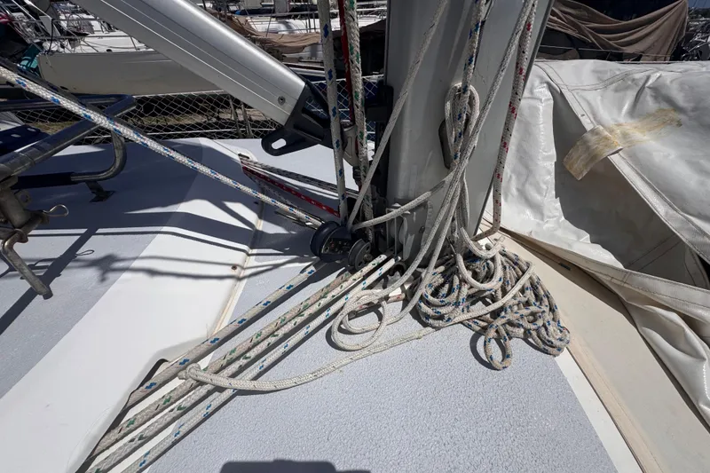Slide: The Image of Deck of 1992 Hunter Passage 42 sailboat with ropes and rigging details. - 64