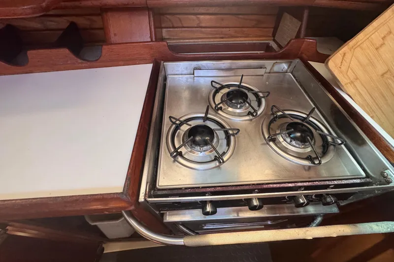 Slide: The Image of Three-burner stove in 1992 Hunter Passage 42 yacht kitchen. - 76