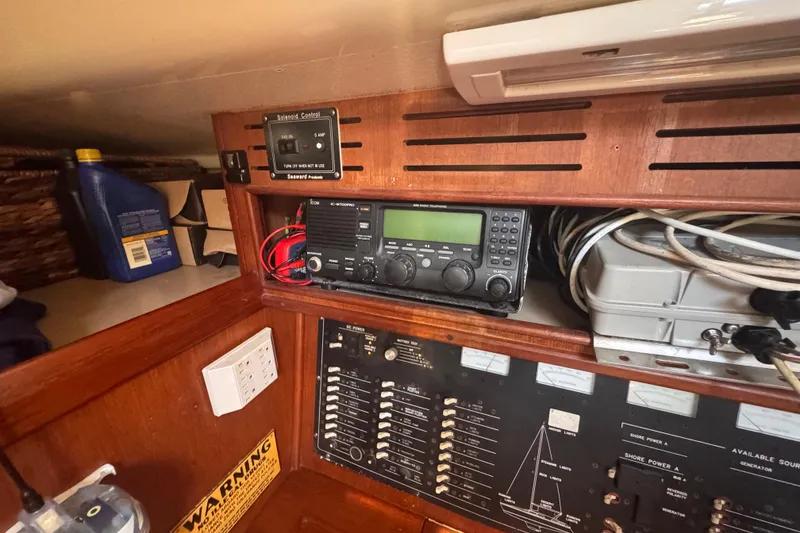 Slide: The Image of Interior of 1992 Hunter Passage 42 sailboat showing navigation equipment and control panel. - 82