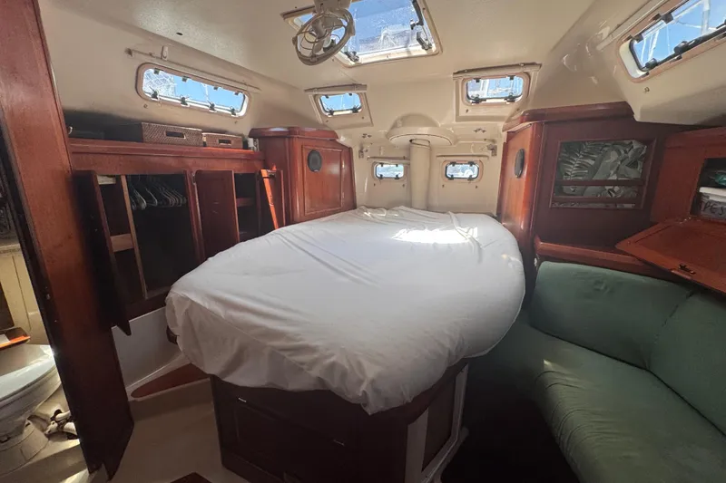 Slide: The Image of Interior of 1992 Hunter Passage 42 sailboat with cozy cabin and wooden furnishings. - 83