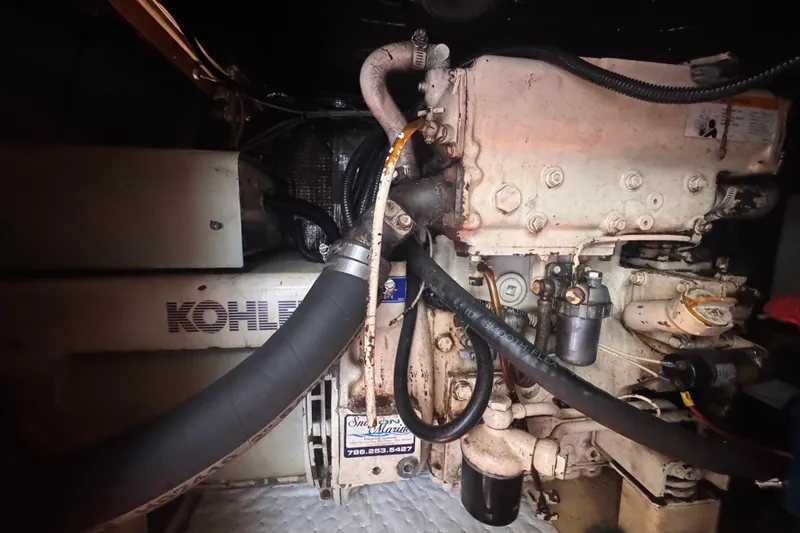 Slide: The Image of Engine compartment of a 1992 Hunter Passage 42 sailboat with Kohler generator. - 88