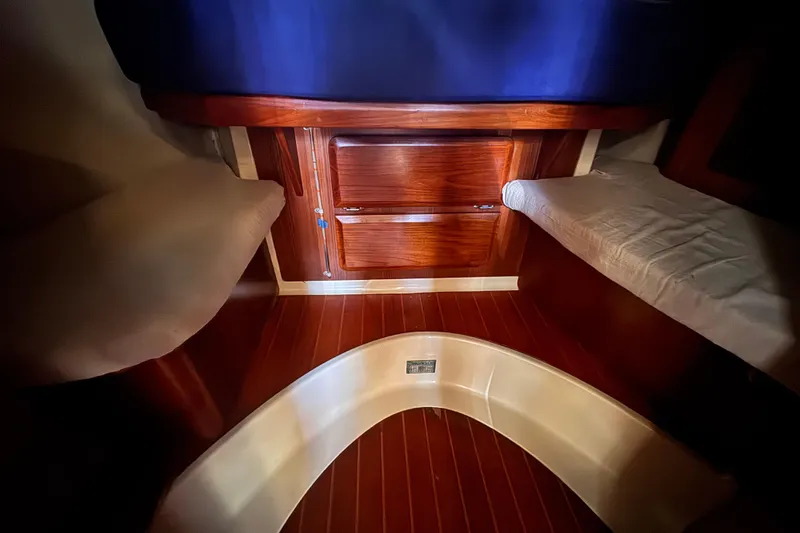 Slide: The Image of Interior cabin of 1992 Hunter Passage 42 sailboat with wooden finish and seating. - 94