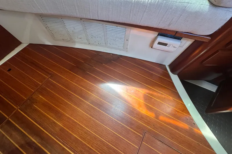 Slide: The Image of Interior of 1992 Hunter Passage 42 yacht with wooden flooring and vent. - 98