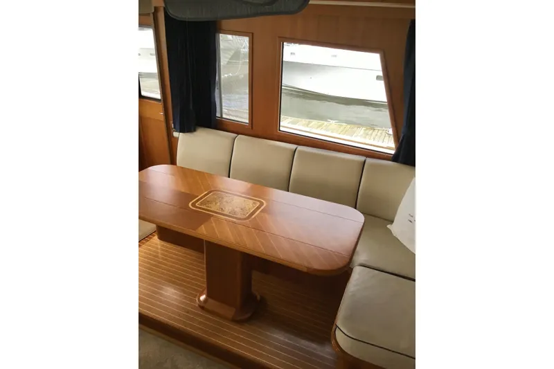 Slide: The Image of Luxurious interior of 2008 Grand Banks 59 Aleutian RP yacht with elegant wood table. - 10
