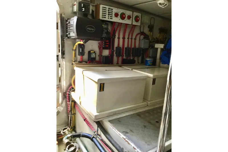 Slide: The Image of Engine room of 2008 Grand Banks 59 Aleutian RP with electrical panels and storage. - 21