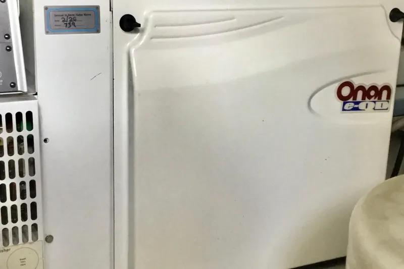 Slide: The Image of Onan generator panel on 2008 Grand Banks 59 Aleutian RP yacht. - 22