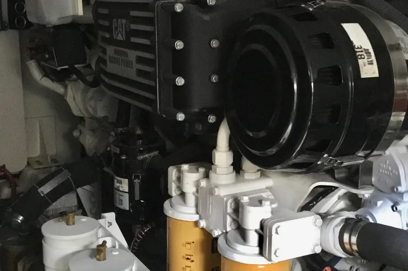 Slide: The Image of Engine room of 2008 Grand Banks 59 Aleutian RP yacht, featuring CAT marine engine components. - 23