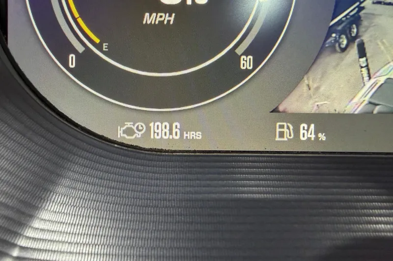 Slide: The Image of Dashboard of 2021 MasterCraft X24 showing 198.6 hours and 64% fuel level. - 14