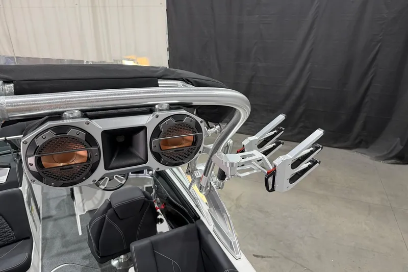 Slide: The Image of 2021 MasterCraft X24 boat with mounted speakers and wakeboard racks. - 15