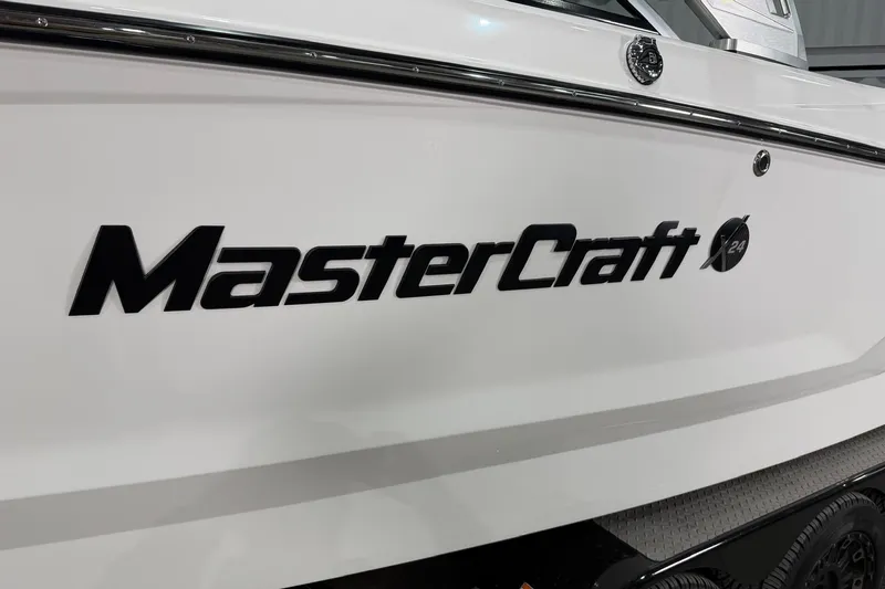 Slide: The Image of 2021 MasterCraft X24 boat side view with logo and model name. - 3