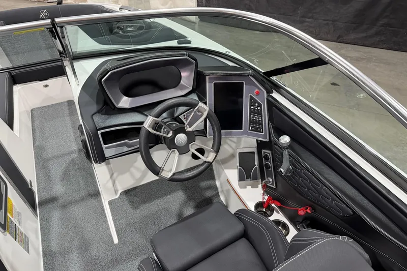 Slide: The Image of 2021 MasterCraft X24 boat interior with modern steering and control panel. - 8