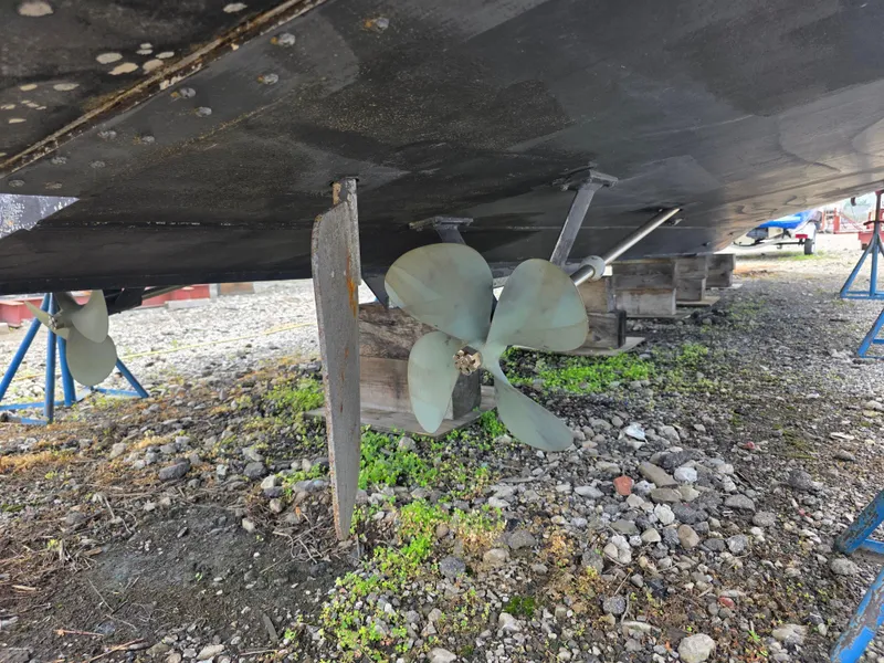Slide: The Image of 1988 Marinette 37 Motor Yacht propeller and rudder on dry dock. - 12