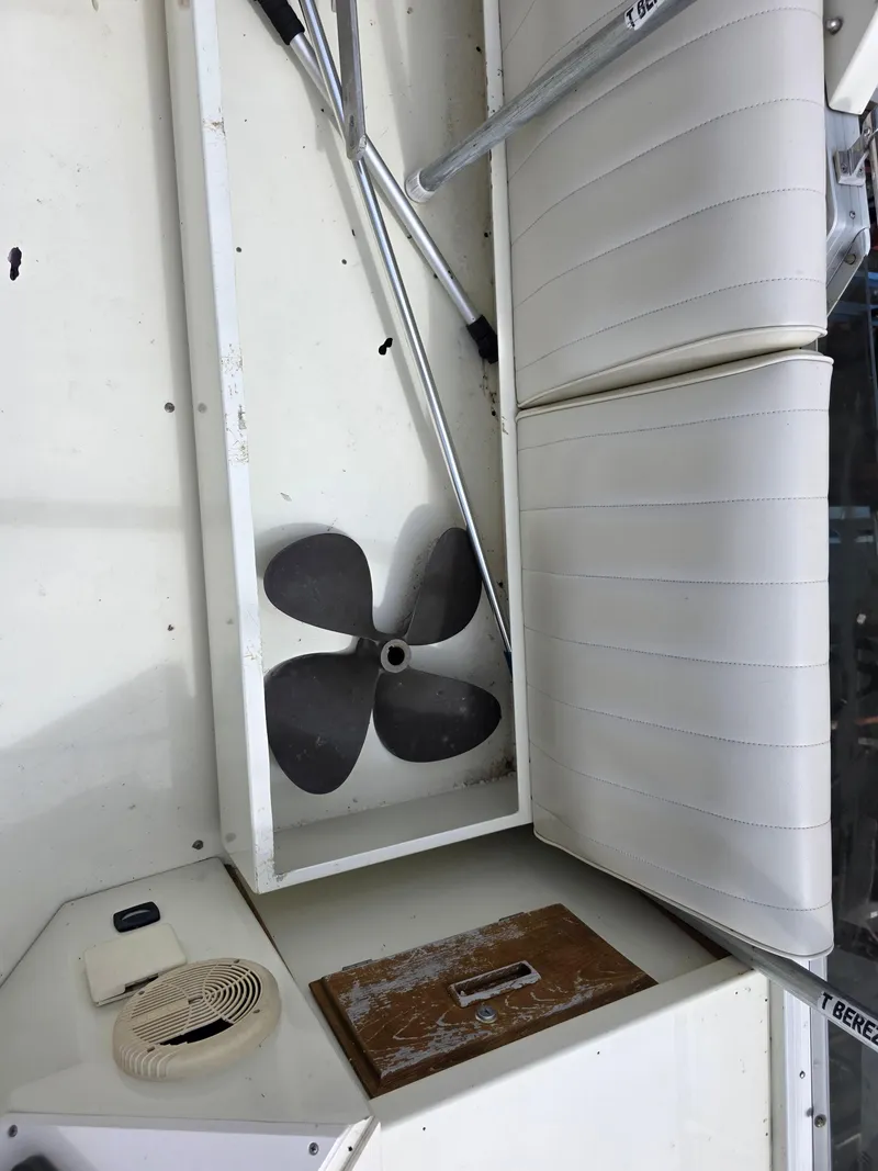 Slide: The Image of 1988 Marinette 37 Motor Yacht interior with propeller and white seating. - 15