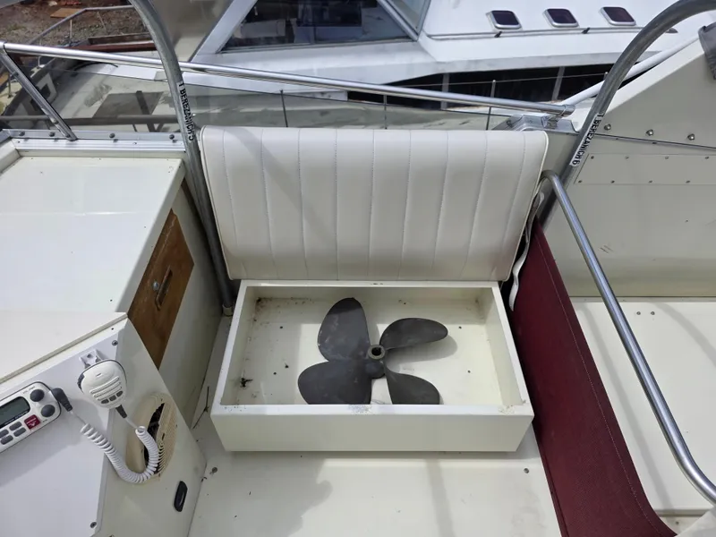 Slide: The Image of 1988 Marinette 37 Motor Yacht interior with propeller storage under seat. - 16