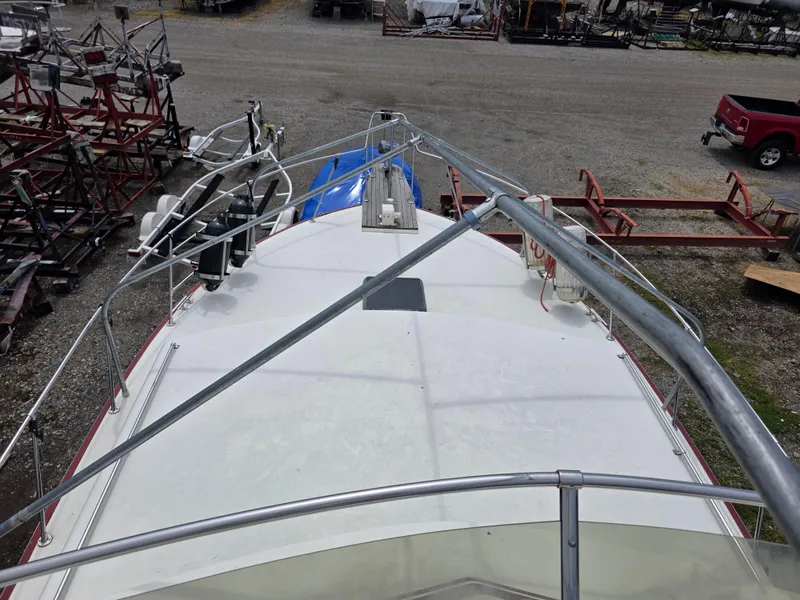 Slide: The Image of 1988 Marinette 37 Motor Yacht deck view with metal railings and equipment. - 7