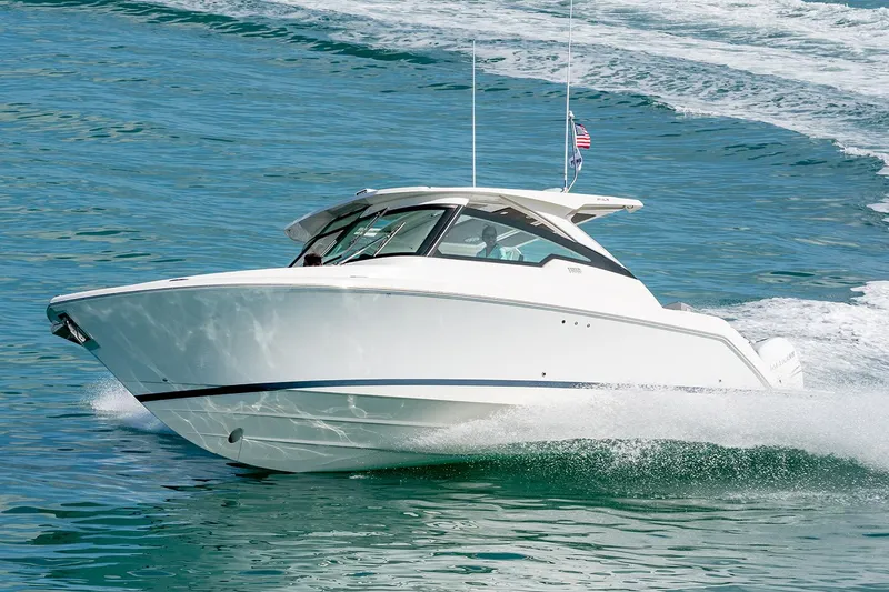 Slide: The Image of Manufacturer Provided Image: 2025 Tiara Yachts 34 LX cruising on open water, showcasing sleek design and performance. - 3